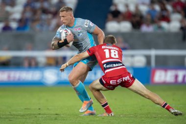 Jimmy Keinhorst #18 of Hull KR tackles Mikolaj Oledzki #8 of Leeds Rhinos during the first half 