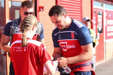 Brad Takairangi #3 of Hull KR  signs a fans shirt