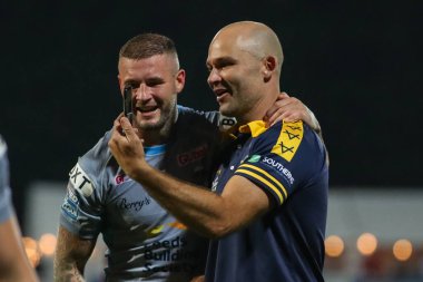 Rohan Smith Head Coach and Zak Hardaker #33 of Leeds Rhinos enjoy a moment after the final whistle