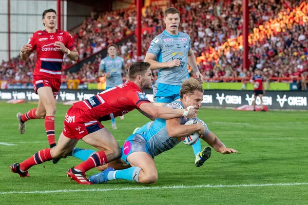 Brad Dwyer #14 of Leeds Rhinos goes over for a try and makes the score 10-4 during the first half 