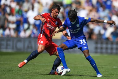 Maxime Colin #2 of Birmingham City  and Jaden Philogene-Bidace #25 of Cardiff City  contest the ball