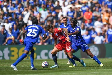 Alfie Chang #42 of Birmingham City Under pressure from Romaine Sawyers #19 of Cardiff City  