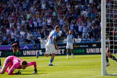 Danny Ward #25 of Huddersfield Town turns away to celebrate after beating Josef Bursik #1 of Stoke City to score his sides second goal
