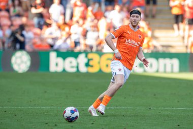 Josh Bowler #11 of Blackpool passes the ball