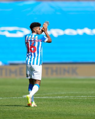 New loan signing Kaine Kesler-Hayden #15 of Huddersfield Town salutes the fans 