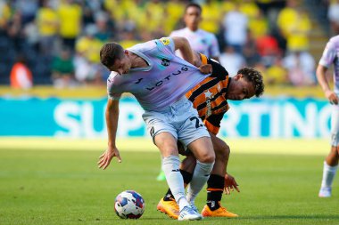 Vaughn Covil #49 of Hull City and KennyMcLean #23 of Norwich City  