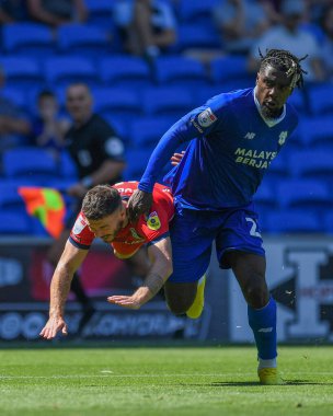 Todd Cantwell #14 of Norwich City and Tobias Figueiredo #6 of Hull City challenge for the ball   