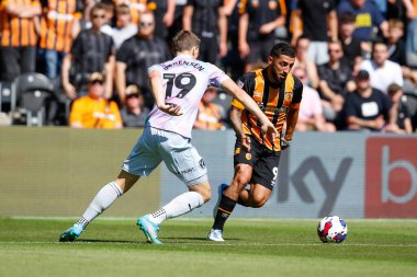 Ozan Tufan #7 of Hull City and Jacob Lungi Srensen #19 of Norwich City  