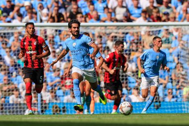 Ilkay Gundogan #8 of Manchester City passes the ball