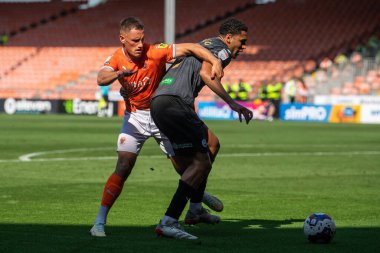 Jerry Yates #9 of Blackpool and Ben Cabango #5 of Swansea City battle for the ball