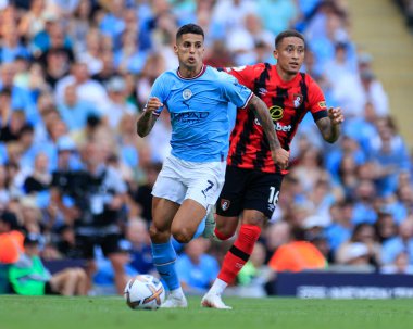 Joao Cancelo #7 of Manchester City  runs from Marcus Tavernier #16 of Bournemouth