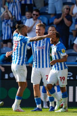 Sorba Thomas #7 of Huddersfield Town  celebrates with scorer of the second Town goal Danny Ward
