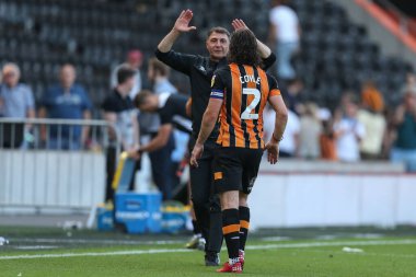 Shota Arveladze manager of Hull City waits to congratulate Lewie Coyle #2 of Hull City   