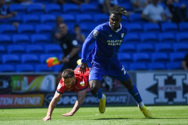 Todd Cantwell #14 of Norwich City and Tobias Figueiredo #6 of Hull City challenge for the ball   