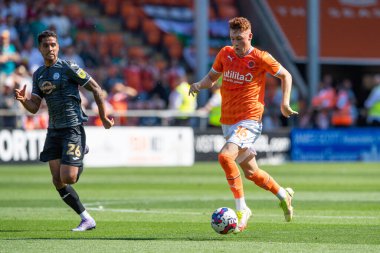 Sonny Carey #16 of Blackpool makes a break with the ball