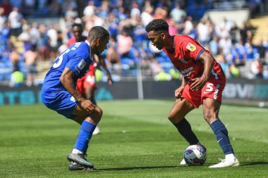 Auston Trusty #5 of Birmingham City  takes on Andy Rinomhota #35 of Cardiff City  