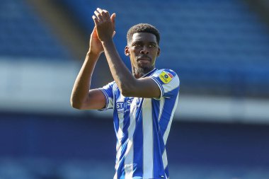 Match winner Tyreeq Bakinson #19 of Sheffield Wednesday applauds the home fans after their 1-0 win