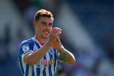 Josh Ruffels #14 of Huddersfield Town salutes the fans after the match