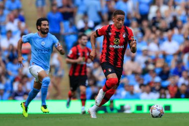 Marcus Tavernier #16 of Bournemouth runs away from Ilkay Gundogan #8 of Manchester City 