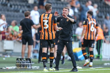 Shota Arveladze manager of Hull City waits to congratulate Callum Elder #3 of Hull City   