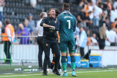Shota Arveladze manager of Hull City waits to congratulate Matt Ingram #1 of Hull City 