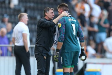 Shota Arveladze manager of Hull City waits to congratulate Matt Ingram #1 of Hull City 