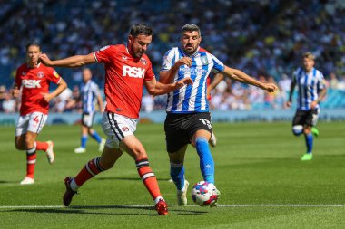 Eoghan O'Connell #6 of Charlton Athletic tackles Callum Paterson #13 of Sheffield Wednesday 