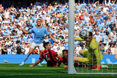 Phil Foden #47 of Manchester City scores to make it 3-0