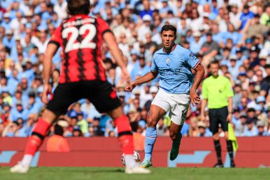 Rodrigo #16 of Manchester City runs with the ball