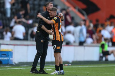 Shota Arveladze manager of Hull City waits to congratulate Regan Slater #27 of Hull City  