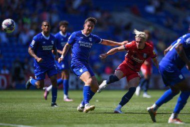 Przemys?aw P?acheta #17 of Birmingham City  shoots at goal, Under pressure from Ryan Wintle #6 of Cardiff City  