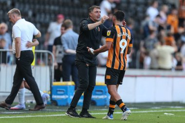 Shota Arveladze manager of Hull City waits to congratulate Allahyar Sayyadmanesh #9 of Hull City  