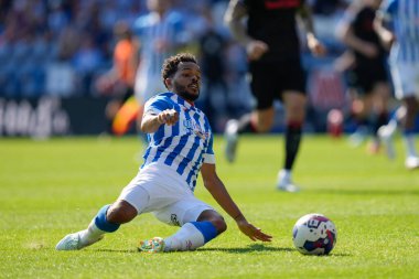 Sorba Thomas #7 of Huddersfield Town slides in on a loose ball