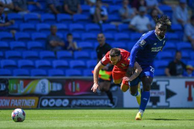 Todd Cantwell #14 of Norwich City and Tobias Figueiredo #6 of Hull City challenge for the ball   