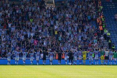 Huddersfield Town players celebrate their win with their fans 