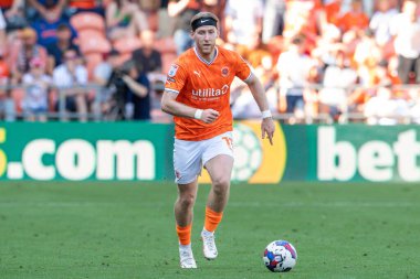 Josh Bowler #11 of Blackpool makes a break with the ball