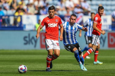 Albie Morgan #10 of Charlton Athletic passes the ball
