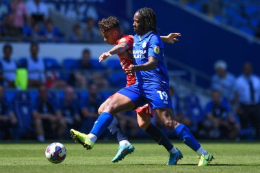 Alfie Chang #42 of Birmingham City Under pressure from Romaine Sawyers #19 of Cardiff City  