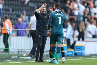 Shota Arveladze manager of Hull City waits to congratulate Matt Ingram #1 of Hull City 