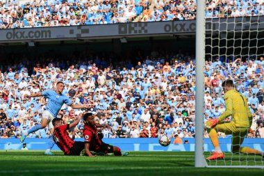 Phil Foden #47 of Manchester City scores to make it 3-0