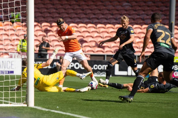 Josh Bowler #11 of Blackpool shoots on goal but its saved by Andy Fisher #1 of Swansea City