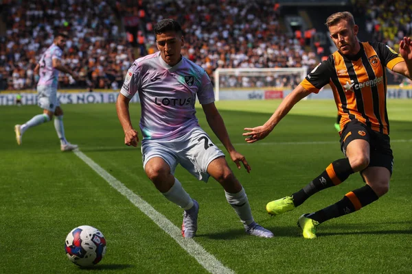 Callum Elder #3 of Hull City blocks the kick from Marcelino Nez #26 of Norwich City  