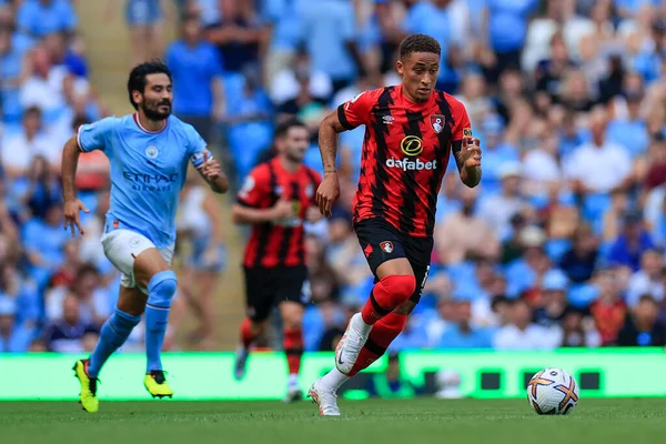 Marcus Tavernier #16 of Bournemouth runs away from Ilkay Gundogan #8 of Manchester City 