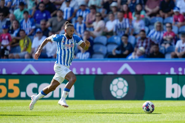 Sorba Thomas #7 of Huddersfield Town breaks away