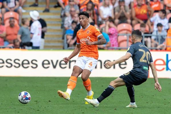 Jordan Lawrence-Gabriel #4 of Blackpool passes the ball