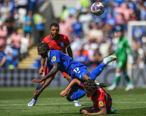 Jamilu Collins #17 of Cardiff City  tackled by Alfie Chang #42 of Birmingham City 