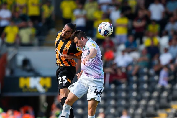 Randell Williams #23 of Hull City and Liam Gibbs #46 of Norwich City 