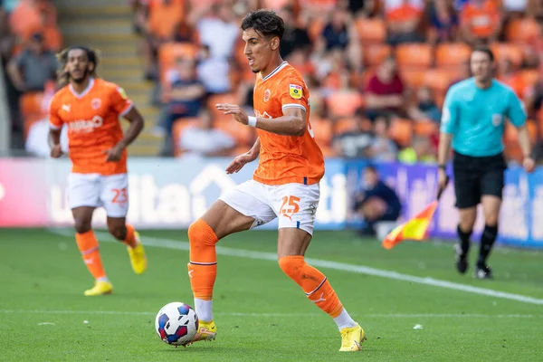 Theo Corbeanu #25 of Blackpool makes a break with the ball