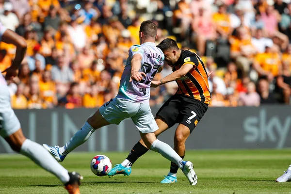 Ozan Tufan #7 of Hull City attempts a shot on goal