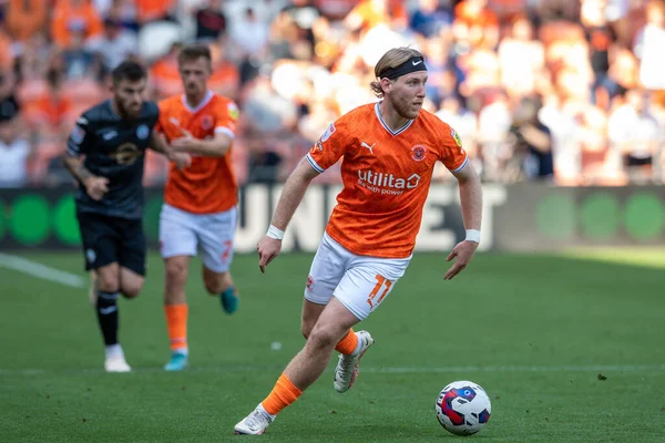 Josh Bowler #11 of Blackpool makes a break with the ball